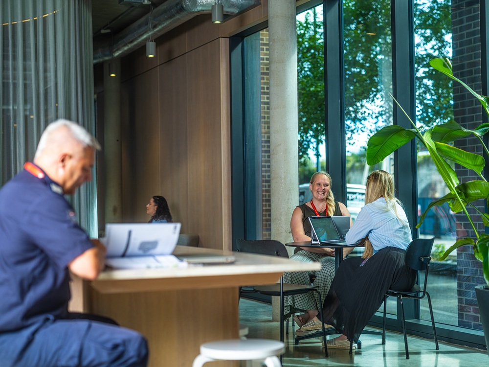 Staff seated in cafe